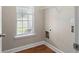 Convenient laundry room with window and built-in shelving at 12 Isabella Ne Ct, Cartersville, GA 30121