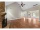 Large living room with beautiful hardwood floors, a stone fireplace, and plenty of space for entertaining at 12 Isabella Ne Ct, Cartersville, GA 30121