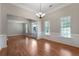 Open living room with wood floors, large windows, and a grand entrance at 12 Isabella Ne Ct, Cartersville, GA 30121