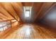 Finished attic featuring high ceilings, wood beams, and a window, offering a unique space with natural light at 218 Green Acre Ln, Cartersville, GA 30121