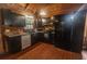 Modern kitchen with black cabinetry, stainless steel appliances, and granite countertops at 218 Green Acre Ln, Cartersville, GA 30121