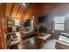 Inviting living room with hardwood floors, a stone fireplace, and rustic wood accents throughout at 218 Green Acre Ln, Cartersville, GA 30121