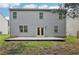 Exterior rear view of house featuring vinyl siding and a concrete patio at 236 Arbor Creek Dr, Dallas, GA 30157
