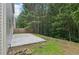 View of backyard featuring a concrete patio and grass at 236 Arbor Creek Dr, Dallas, GA 30157