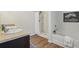 Well-lit bathroom featuring a garden tub, walk-in shower, and a vanity with a sink at 236 Arbor Creek Dr, Dallas, GA 30157