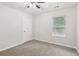 Standard bedroom with neutral carpet and a window offering outdoor views at 236 Arbor Creek Dr, Dallas, GA 30157