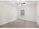 Bright and airy bedroom with neutral carpet and a ceiling fan at 236 Arbor Creek Dr, Dallas, GA 30157