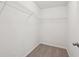 A simple, empty walk-in closet with carpeted flooring and white wire shelving at 236 Arbor Creek Dr, Dallas, GA 30157