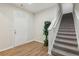 Entryway featuring hardwood floors, a white door, and a carpeted staircase at 236 Arbor Creek Dr, Dallas, GA 30157