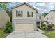 Charming two-story house with a two-car garage, well-maintained lawn, and inviting curb appeal at 236 Arbor Creek Dr, Dallas, GA 30157