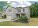 Beautiful two-story home boasts an attached garage, a well-kept lawn, and delightful landscaping at 236 Arbor Creek Dr, Dallas, GA 30157