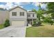 Inviting two-story home featuring a two-car garage, landscaped front yard, and covered entry way at 236 Arbor Creek Dr, Dallas, GA 30157