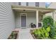 Inviting front porch features modern chairs, attractive landscaping, and a welcoming entrance at 236 Arbor Creek Dr, Dallas, GA 30157
