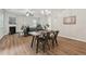 Open-concept living room showcasing a dining area and fireplace at 236 Arbor Creek Dr, Dallas, GA 30157