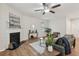 Comfortable living room featuring a fireplace, ceiling fan, and neutral decor at 236 Arbor Creek Dr, Dallas, GA 30157
