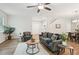 Inviting living room with hardwood floors, comfortable seating, and seamless flow to the dining area at 236 Arbor Creek Dr, Dallas, GA 30157