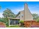 Beautiful backyard with a screened porch, manicured lawn, and wooden fence at 3573 Willow Tree Trce, Decatur, GA 30034