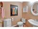 Powder room includes vanity, toilet, and decorative accents at 3573 Willow Tree Trce, Decatur, GA 30034