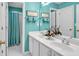 Clean bathroom with a double vanity, white cabinets, and a separate shower area, creating a fresh aesthetic at 3573 Willow Tree Trce, Decatur, GA 30034