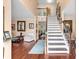 Bright and airy foyer with beautiful hardwood floors, a classic staircase, and elegant decor at 3573 Willow Tree Trce, Decatur, GA 30034