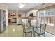 Eat-in kitchen has stainless steel appliances and glass table with chairs near the breakfast area at 3573 Willow Tree Trce, Decatur, GA 30034