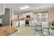 Traditional eat-in kitchen features granite countertops, stainless steel appliances, and a sunlit breakfast area at 3573 Willow Tree Trce, Decatur, GA 30034