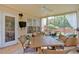 Relaxing sunroom featuring comfortable seating, large windows, and natural light, perfect for relaxation at 3573 Willow Tree Trce, Decatur, GA 30034