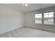 Bedroom with carpet and two windows at 389 Navigator Ln, Mcdonough, GA 30253