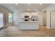 Modern kitchen features a center island, white cabinets, and stainless steel appliances at 389 Navigator Ln, Mcdonough, GA 30253