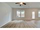 Spacious living room featuring wood floors and lots of natural light from the windows at 389 Navigator Ln, Mcdonough, GA 30253