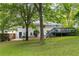 Back exterior view showcasing a deck and a well-maintained backyard at 1060 Pinedale Se Dr, Smyrna, GA 30080