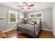 Bedroom with a bed, wood floors, and natural light from the window at 1060 Pinedale Se Dr, Smyrna, GA 30080