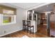 Eat-in breakfast bar with a view into the kitchen and stainless steel appliances at 1060 Pinedale Se Dr, Smyrna, GA 30080