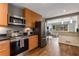 Open kitchen with stainless steel appliances and a view to the living room at 1060 Pinedale Se Dr, Smyrna, GA 30080