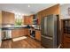 Modern kitchen featuring stainless steel appliances and wood cabinets at 1060 Pinedale Se Dr, Smyrna, GA 30080