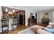 Open-concept living area featuring a breakfast bar and hardwood floors at 1060 Pinedale Se Dr, Smyrna, GA 30080