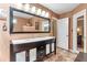 Bathroom with a double sink vanity with a large mirror and modern lighting fixtures above at 2000 Kristian Way, Roswell, GA 30076