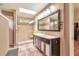 Spacious bathroom featuring a double vanity, walk-in shower, and skylight for natural light at 2000 Kristian Way, Roswell, GA 30076