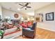Open-concept living room with vaulted ceilings, fireplace, hardwood floors, and seamless flow to the dining area at 2000 Kristian Way, Roswell, GA 30076