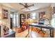 Office space with hardwood floors, a desk, a bookshelf, and natural light from the windows at 2000 Kristian Way, Roswell, GA 30076
