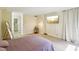 Bright bedroom featuring a TV for entertainment and a balcony at 3530 Piedmont Ne Rd # 2I, Atlanta, GA 30305