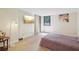 Bright bedroom featuring a large window and a TV for entertainment at 3530 Piedmont Ne Rd # 2I, Atlanta, GA 30305