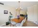 Cozy dining area offering a rustic table and access to the living room at 3530 Piedmont Ne Rd # 2I, Atlanta, GA 30305