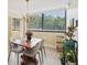 Charming dining room with modern chairs and oversized windows for natural light at 3530 Piedmont Ne Rd # 2I, Atlanta, GA 30305