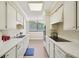 Well-maintained kitchen with a window view and seamless access to the dining area at 3530 Piedmont Ne Rd # 2I, Atlanta, GA 30305