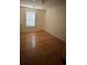 Comfortable bedroom with hardwood floors and a window, offering a peaceful retreat at 425 Rockingham Ln, Woodstock, GA 30189