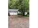 Home featuring a spacious two car garage and well maintained landscaping at 425 Rockingham Ln, Woodstock, GA 30189