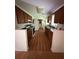 Functional kitchen with wood cabinetry, stainless steel appliances, and an adjacent eating area at 425 Rockingham Ln, Woodstock, GA 30189