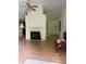 Spacious living room with a cozy fireplace, and views into the kitchen area at 425 Rockingham Ln, Woodstock, GA 30189