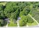Aerial view showcases the expansive lot and mature trees surrounding the home at 1395 Clay Sw Rd, Mableton, GA 30126